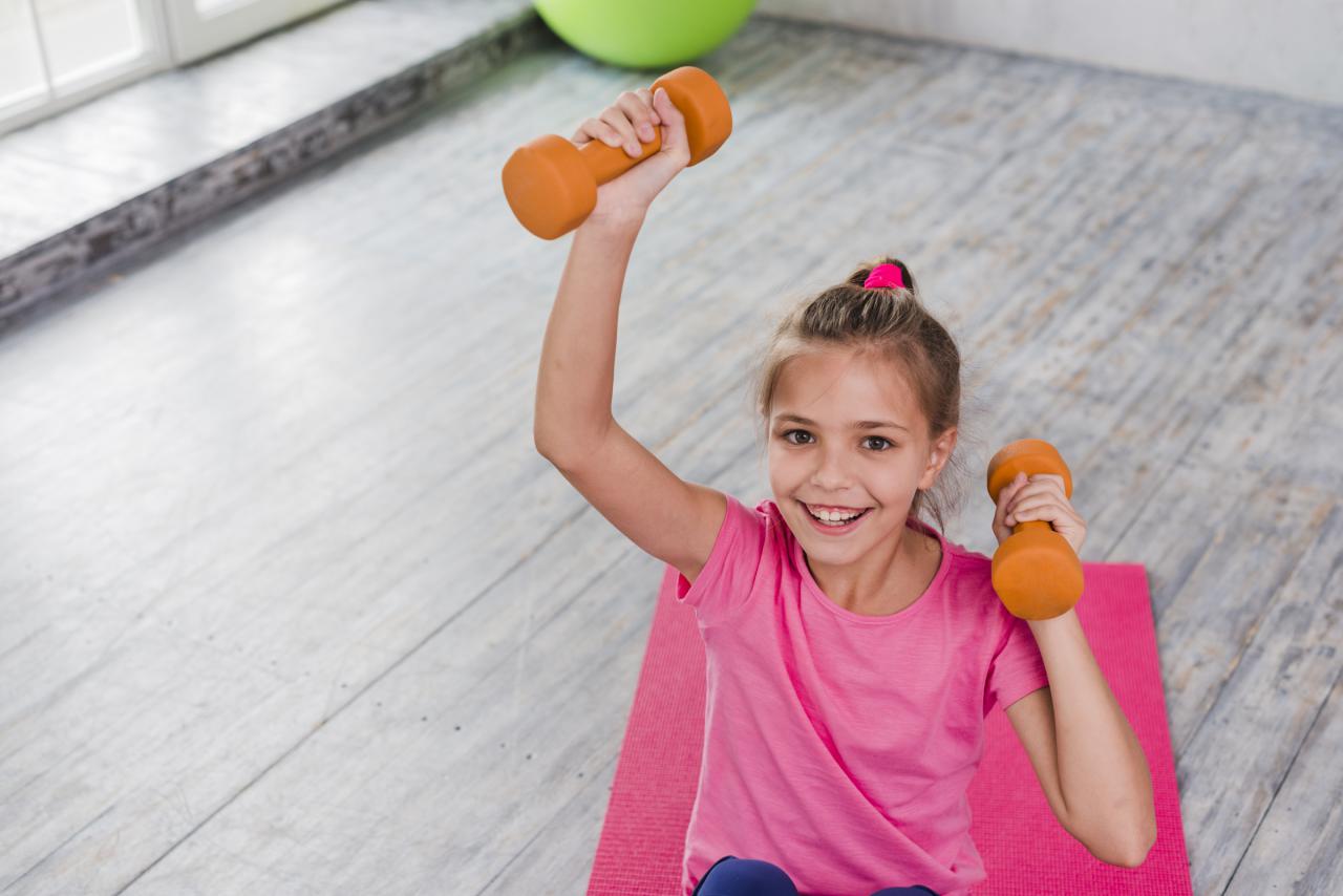 Girl exercising with light wheight